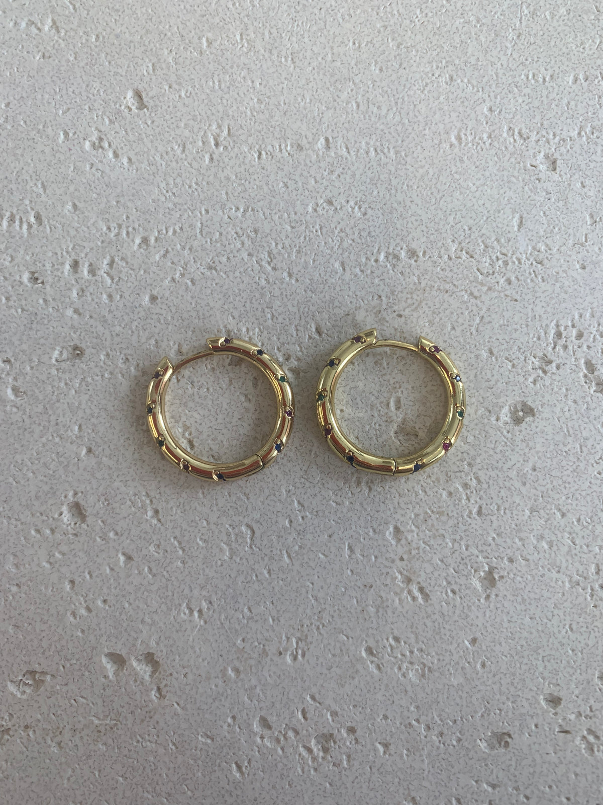 Gold crystal paved huggie hoops