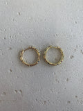 Gold crystal paved huggie hoops