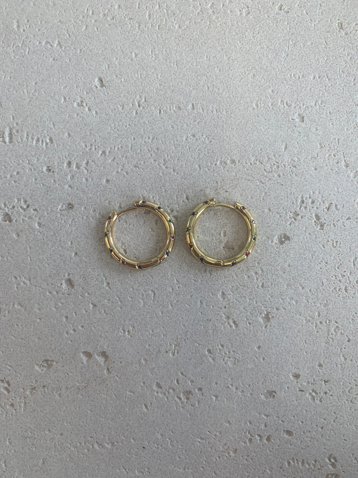 Gold crystal paved huggie hoops
