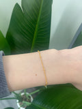 Gold saturn beaded bracelet